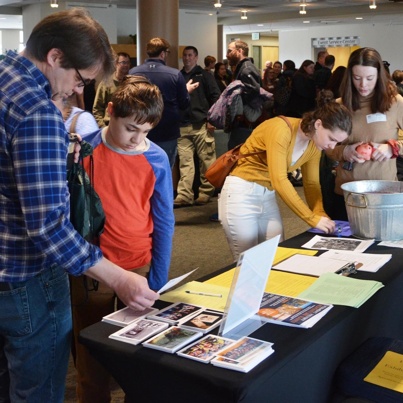 four people at registration desk for Vermont History Day 2019