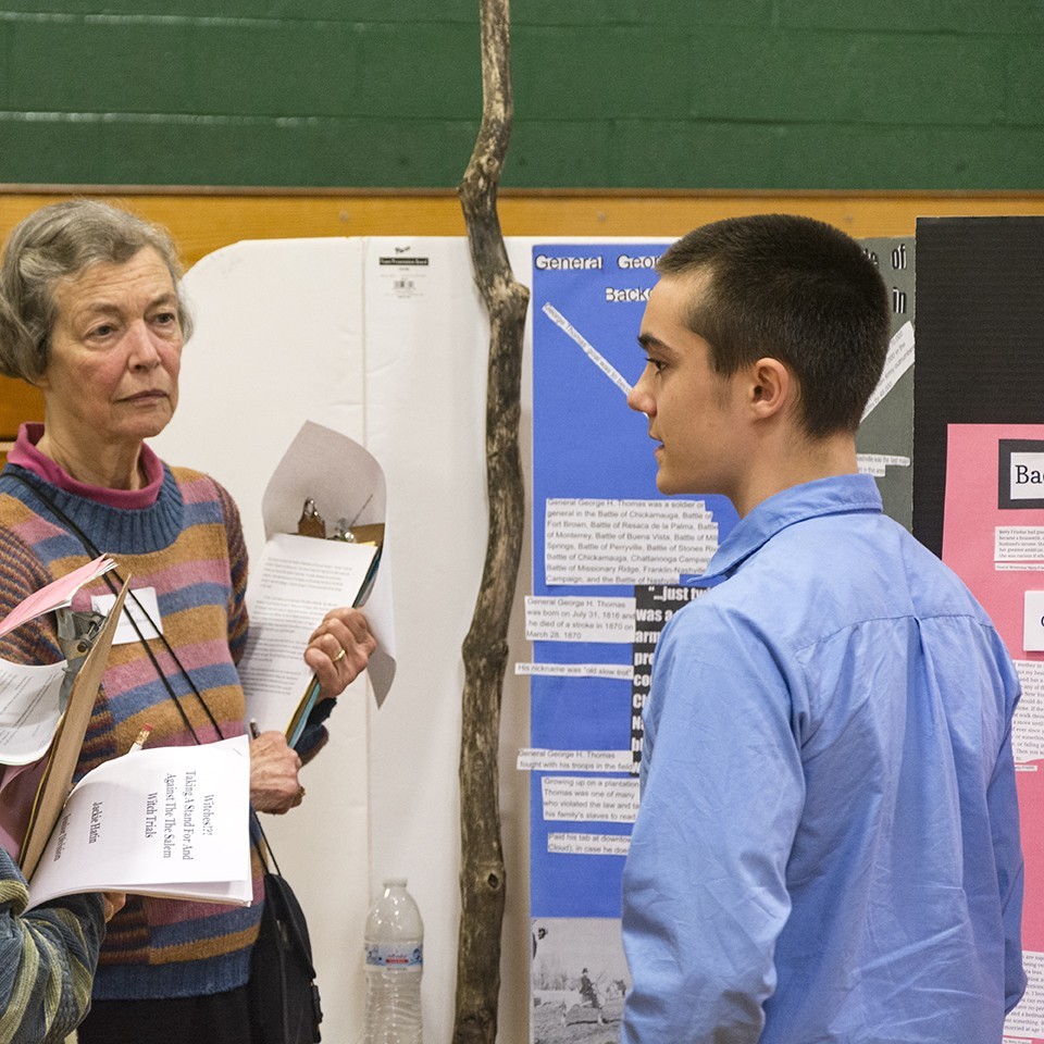 Judge interviewing a student at Vermont History Day.